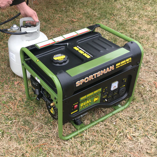 Green and black generator in grass